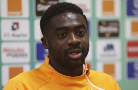 FILE-In this file photo taken on Tuesday, Jan. 27, 2015, Ivory Coast soccer player, Kolo Toure, speaks during a press conference in Malabo, Equatorial Guinea.  Ivory Coast will still be in celebration mode on its return to action after winning the African Cup of Nations, giving one final call-up to retired pair Boubacar Barry and Kolo Toure to allow them to go out in front of their home crowd. (AP Photo/Sunday Alamba, File)