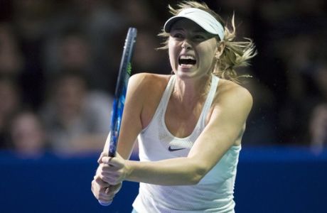 Russia's Maria Sharapova plays a return during the first round match against Slovakia's Magdalena Rybarikova at the Kremlin Cup tennis tournament in Moscow, Russia, Tuesday, Oct. 17, 2017. Sharapova returned in April from a 15-month doping ban and won her first title of the season last week in Tianjin, China. (AP Photo/Alexander Zemlianichenko)