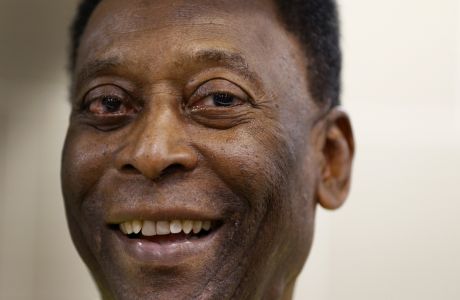 FILE - Brazilian soccer legend Pele smiles during a media opportunity at a restaurant in London, March 20, 2015. Pelé, the Brazilian king of soccer who won a record three World Cups and became one of the most commanding sports figures of the last century, died in Sao Paulo on Thursday, Dec. 29, 2022. He was 82. (AP Photo/Kirsty Wigglesworth, File)