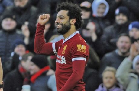 Liverpool's Mohamed Salah celebrates scoring his side's second goal of the game against West Ham, during the English Premier League soccer match between Liverpool and West Ham United at Anfield in Liverpool, England, Saturday, Feb. 24, 2018. (AP Photo/Rui Vieira)
