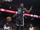 Golden State Warriors' Kevin Durant (35) scores against the Miami Heat during the second half of an NBA basketball game, Sunday, Feb. 10, 2019, in Oakland, Calif. (AP Photo/Ben Margot)
