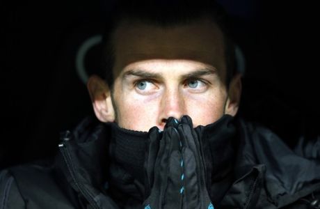 Real Madrid's Gareth Bale sits on the bench during a Spanish La Liga soccer match between Real Madrid and Girona at the Santiago Bernabeu stadium in Madrid, Spain, Sunday, March 18, 2018. (AP Photo/Paul White)