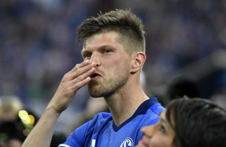 FILE - In this May 13, 2017 file photo, Schalke's forward Klaas Jan Huntelaar gives a kiss to his fans after his last home match between FC Schalke 04 and Hamburger SV in Gelsenkirchen, Germany. Schalke said the 37-year-old Huntelaar, who scored 126 goals in 240 competitive games in his previous stint at the German club between 2010-17, signed a deal to the end of the season. Schalke is hoping Huntelaar can help it avoid relegation.  (AP Photo/Martin Meissner, File)