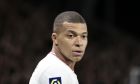 PSG's Kylian Mbappe looks on during the League One soccer match between Angers and Paris Saint Germain, at the Raymond-Kopa stadium in Angers, western France, Wednesday, April 20, 2022. (AP Photo/Jeremias Gonzalez)
