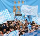 MANCHESTER, ENGLAND - MAY 12:  Supporters of Manchester City wait outside Manchester Town Hall prior to the start of the Manchester City victory parade around the streets of Manchester on May 12, 2014 in Manchester, England.  (Photo by Alex Livesey/Getty Images)