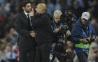 Manchester City head coach Pep Guardiola, right and Shakhtar's head coach Paulo Fonseca speak after the end of the Champions League Group F soccer match between Manchester City and Shakhtar Donetsk at Etihad stadium, Manchester, England, Tuesday, Sept. 26, 2017. City won the game 2-0. (AP Photo/Rui Vieira)