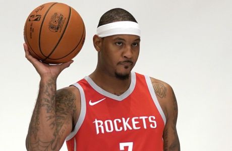 Houston Rockets' Carmelo Anthony (7) poses for a photographer during media day Monday, Sept. 24, 2018, in Houston. (AP Photo/David J. Phillip)