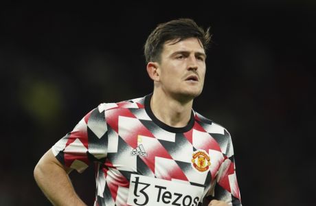Manchester United's Harry Maguire warms up prior to the English League Cup third round soccer match between Manchester United and Aston Villa at Etihad Stadium in Manchester, England, Thursday, Nov. 10, 2022. (AP Photo/Dave Thompson)