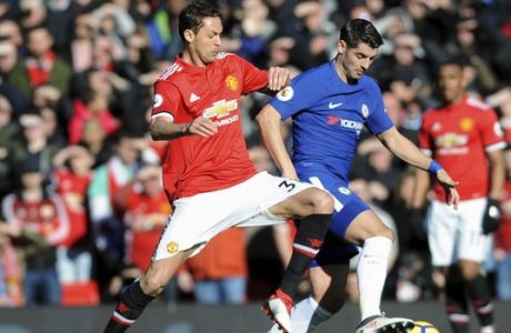 Manchester United's Nemanja Matic, left, challenges for the ball with Chelsea's Alvaro Morata during the English Premier League soccer match between Manchester United and Chelsea at the Old Trafford stadium in Manchester, England, Sunday, Feb. 25, 2018. (AP Photo/Rui Vieira)