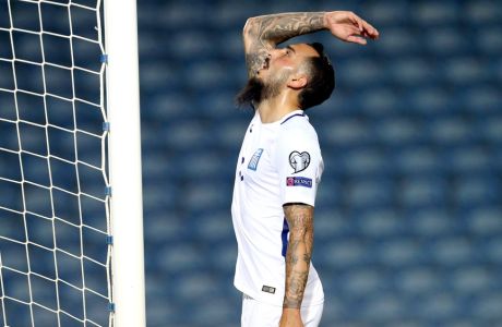 Greece's Kostas Mitroglou gestures during the World Cup Group H qualifying soccer match between Gibraltar and Greece outside Faro, southern Portugal, Tuesday, Sept. 6, 2016. (AP Photo/Armando Franca)