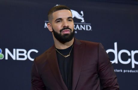 FILE - This May 1, 2019 file photo shows Drake at the Billboard Music Awards in Las Vegas. Earning his 21st No. 1 hit on Billboard's R&B/Hip-Hop songs chart, Drake has bested a record previously held by icons Aretha Franklin and Stevie Wonder. Drake's Laugh Now Cry Later," featuring rapper Lil Durk, reached the No. 1 spot on the chart this week. Wonder and Franklin, who died in 2018, each have had 20 songs top the chart. (Photo by Richard Shotwell/Invision/AP, File)
