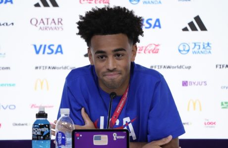 Tyler Adams of the United States attends a press conference on the eve of the group B World Cup soccer match between England and the United States, in Doha, Qatar, Thursday, Nov. 24, 2022. (AP Photo/Ashley Landis)