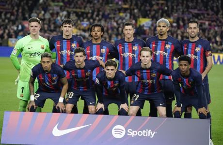 Barcelona pose for a team photo ahead of the Spanish La Liga soccer match against Real Madrid at Camp Nou stadium in Barcelona, Spain, Sunday, March 19, 2023. (AP Photo/Joan Mateu)