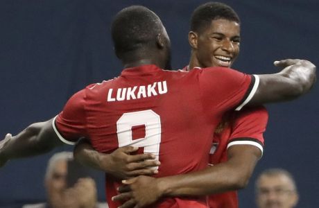 Manchester United's Marcus Rashford, right, is congratulated by teammate Romelu Lukaku, left, after scoring a goal against Manchester City during the first half of an International Champions Cup soccer match in Houston, Thursday, July 20, 2017. (AP Photo/David J. Phillip)