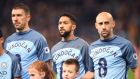 MANCHESTER, ENGLAND - DECEMBER 18: Gael Clichy of Manchester City  and his Manchester City team mates wear Ilkay Gundogan of Manchester City shirt in surport for him after he was injured during the Premier League match between Manchester City and Arsenal at the Etihad Stadium on December 18, 2016 in Manchester, England.  (Photo by Michael Regan/Getty Images)