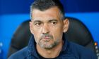 Porto's head coach Sergio Conceicao watches on the bench prior the UEFA Champions League Group H soccer match between Shakhtar Donetsk and FC Porto in Hamburg, Germany, Tuesday, Sept. 19, 2023. (AP Photo/Martin Meissner)