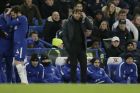 Chelsea manager Antonio Conte, right, looks dejected after Bournemouth's second goal as Chelsea's Cesc Fabregas, left, waits the be substituted during the English Premier League soccer match between Chelsea and Bournemouth at Stamford Bridge in London, Wednesday Jan. 31, 2018. (AP Photo/Tim Ireland)