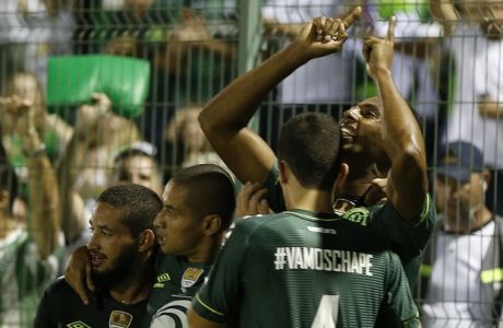 Luiz Otavio of Brazil's Chapecoense, right, celebrates with teammates after scoring against Colombia's Atletico Nacional, during a Recopa Sudamericana first leg final soccer match in Chapeco, Brazil, Tuesday, April 4, 2017. (AP Photo/Andre Penner)