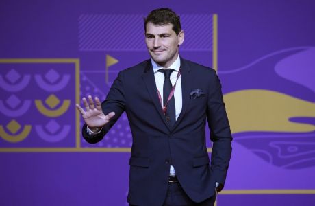 Former Spanish soccer international Iker Casillas waves as he arrives for the 2022 soccer World Cup draw at the Doha Exhibition and Convention Center in Doha, Qatar, Friday, April 1, 2022. (AP Photo/Darko Bandic)
