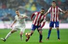 Sporting Gijon's Brazilian defender Douglas (C) vies with Real Madrid's midfielder Lucas Vazquez (L) during the Spanish league football match Real Madrid CF vs Real Sporting de Gijon at the Santiago Bernabeu stadium in Madrid on November 26, 2016. / AFP / JAVIER SORIANO        (Photo credit should read JAVIER SORIANO/AFP/Getty Images)