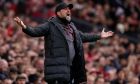 Liverpool's manager Jurgen Klopp yells during the FA Cup quarterfinal soccer match between Manchester United and Liverpool at the Old Trafford stadium in Manchester, England, Sunday, March 17, 2024. (AP Photo/Dave Thompson)