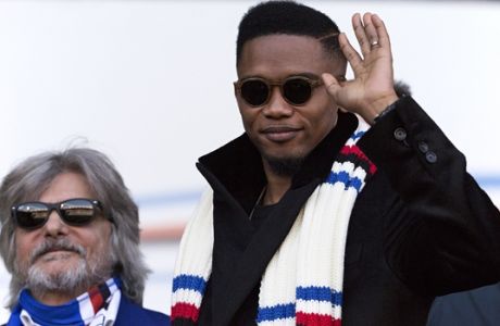 FILE -- In this photo taken on Jan. 25, 2015 in Genoa, Samuel Eto'o, right, poses with Sampdoria President Massimo Ferrero as they sit in the stands prior to a Serie A soccer match between Sampdoria and Palermo. Four-time African player of the year Samuel Eto'o has threatened to sue his former club Sampdoria over a contract dispute. (AP Photo/Carlo Baroncini)