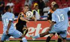 Utrecht's Dries Mertens tries a shot as Napoli's  Juan Camilo Zúñiga, left, of Colombia, and Fabiano Santacroce, right, try to oppose him during an Europa League, Group K, soccer match between Napoli and Utrecht at the San Paolo stadium in Naples, southern Italy, Thursday, Sept 16, 2010.  (AP Photo/Salvatore Laporta)