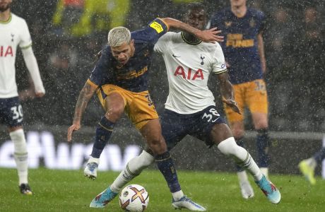 Tottenham's Yves Bissouma, right, challenges for the ball with Newcastle's Bruno Guimaraes during the English Premier League soccer match between Tottenham Hotspur and Newcastle United at the Tottenham Hotspur Stadium in London, England, Sunday, Oct. 23, 2022. (AP Photo/Frank Augstein)