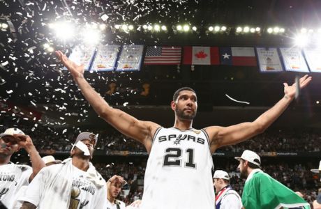 SAN ANTONIO, TX - JUNE 15: Tim Duncan #21 of the San Antonio Spurs reacts with teammates after winning 2014 NBA Finals at AT&T Center on June 15, 2014 in San Antonio, Texas. NOTE TO USER: User expressly acknowledges and agrees that, by downloading and/or using this photograph, user is consenting to the terms and conditions of the Getty Images License Agreement.  Mandatory Copyright Notice: Copyright 2014 NBAE (Photo by Nathaniel S. Butler/NBAE via Getty Images)