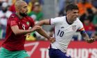 United States forward Christian Pulisic (10) dribbles past Morocco's Sofyan Amrabat (4) during the first half of a friendly soccer match, Wednesday, June 1, 2022, in Cincinnati. (AP Photo/Jeff Dean)