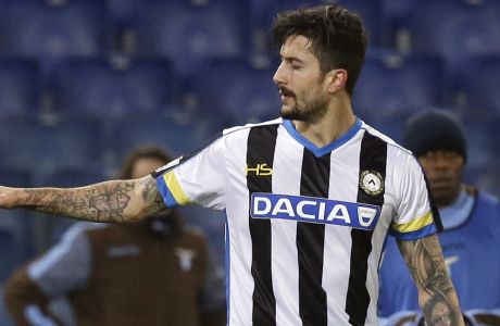 Udinese's Panagiotis Kone, right, celebrates with an unidentified teammate after scoring during the Italian Cup soccer match against Lazio at Rome's Olympic stadium, Thursday, Dec. 17, 2015. (AP Photo/Gregorio Borgia) 