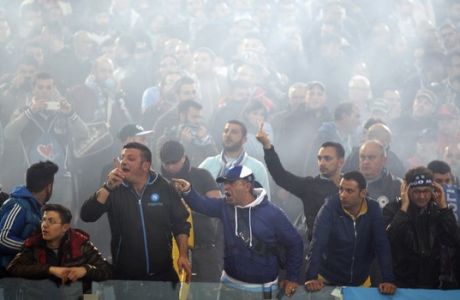  Napoli's supporters shout before the Italian Cup final soccer match between Fiorentina and Napoli Rome's Olympic stadium, Saturday, May 3, 2014. At least one fan and one police officer were reportedly shot before the Italian Cup final between Napoli and Fiorentina, and the fan was in serious condition. As a result, the start of the final was delayed, and there were scenes of violence inside the stadium with a firefighter injured by fireworks thrown from the stands. The shootings occurred in an area where Napoli fans were gathering for the match, the ANSA news agency reported. (AP Photo/Alessandra Tarantino)