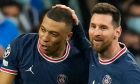 PSG's Lionel Messi, right, congratulates PSG's Kylian Mbappe after he scored his side's first goal during the Champions League, round of 16, second leg soccer match between Real Madrid and Paris Saint-Germain at the Santiago Bernabeu stadium in Madrid, Spain, Wednesday, March 9, 2022. (AP Photo/Manu Fernandez)