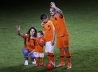 Wesley Sneijder of The Netherlands greets fans as he walks off the pitch with his wife Yolanthe, left, and his children Xess Xava, second left, and Jessey, second right, as he retires from international soccer after the international friendly soccer match between The Netherlands and Peru at the Johan Cruijff ArenA in Amsterdam, Netherlands, Thursday, Sept. 6, 2018. The friendly against Peru is the 134th and last for 34-year-old Sneijder, a Dutch record. His first international was a 1-1 draw with Portugal on April 30, 2003. The attacking midfielder has played for clubs including Ajax, Real Madrid and Inter Milan. (AP Photo/Peter Dejong)