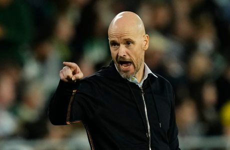 Manchester United's head coach Erik ten Hag gestures during the Europa League round of 16 second leg soccer match between Real Betis and Manchester United at the Benito Villamarin stadium in Seville, Spain, Thursday, March 16, 2023. (AP Photo/Jose Breton)