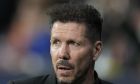 Atletico Madrid's head coach Diego Simeone waits for the start of the group B Champions League soccer match between Atletico Madrid and Bayer 04 Leverkusen at the Civitas Metropolitano stadium in Madrid, Spain, Wednesday, Oct. 26, 2022. (AP Photo/Manu Fernaandez)