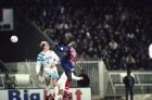 PSG player George Weah, right, clashes with Olympique Marseille defender William Pruiner during their first division French championship match on Friday, Jan. 14, 1994 in Paris. (AP Photo/Lionel Cironneau)