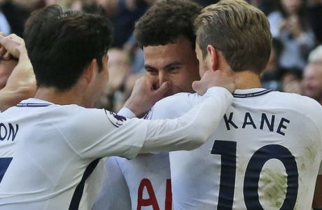 Tottenham's Dele Alli, center, Tottenham's Son Heung-min, left, and Tottenham's Harry Kane celebrate after scoring their side's third goal during the English Premier League soccer match between Tottenham Hotspur and Liverpool at Wembley Stadium in London, Sunday, Oct. 22, 2017.(AP Photo/Frank Augstein)
