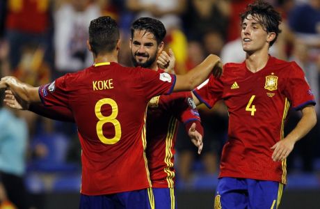 Spain's Isco, center, celebrates with Koke and Avaro Odriozola, right, after scoring his side's second goal during the World Cup Group G qualifying soccer match between Spain and Albania at the Rico Perez stadium in Alicante, Spain, Friday, Oct. 6, 2017. (AP Photo/Alberto Saiz)