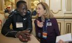 Boston Marathon defending women's champion Edna Kiplagat, left, of Kenya, speaks to Kathrine Switzer, the first official woman entrant in the Boston Marathon 50 years ago, at a news conference, Friday, April 13, 2018, in Boston. The 122nd running of the Boston Marathon is scheduled for Monday. (AP Photo/Elise Amendola)