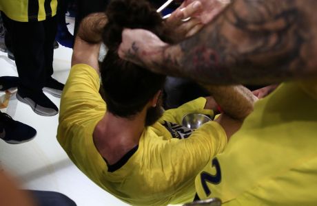 Fenerbahce's Pero Antic, right, cuts the hair of his teammate Luigi Datome after their victory at the Final Four Euroleague at Sinan Erdem Dome in Istanbul, Sunday, May 21, 2017. Fenerbahce won Olympiakos 80-64. (AP Photo/Lefteris Pitarakis)