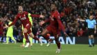 Liverpool's Georginio Wijnaldum, right, celebrates scoring his side's third goal of the game during the Champions League Semi Final, second leg soccer match between Liverpool and Barcelona at Anfield, Liverpool, England, Tuesday, May 7, 2019. (Peter Byrne/PA via AP)