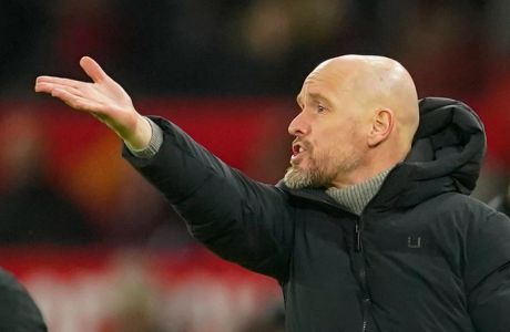 Manchester United's head coach Erik ten Hag gives instructions to his players during the English Premier League soccer match between Manchester United and Chelsea at Old Trafford stadium in Manchester, England, Wednesday, Dec. 6, 2023. (AP Photo/Dave Thompson)